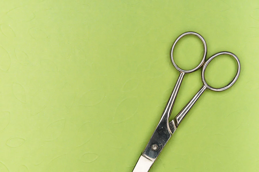 scissors used to trim wallpaper