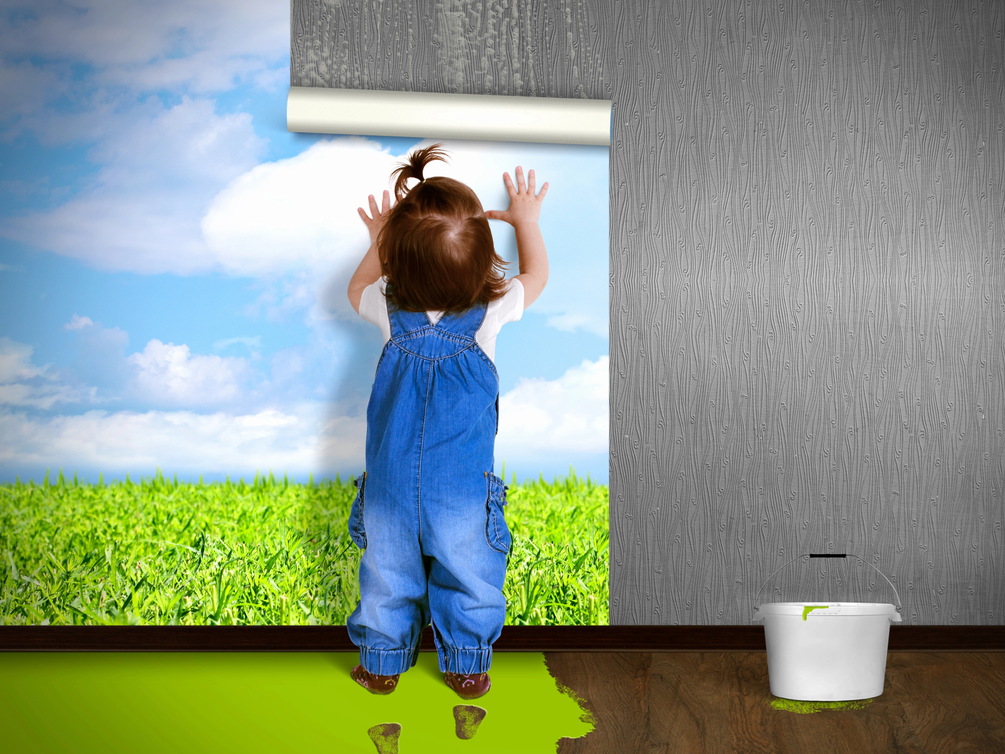 Child helping with home wallpaper installation and repairs